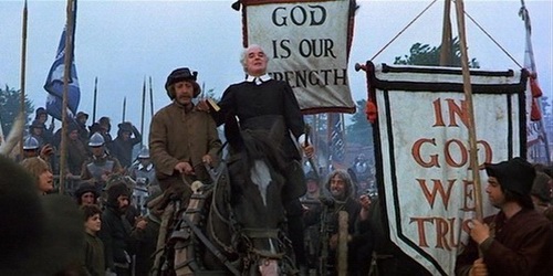 The Puritan Army goes to war against the king
singing hymns under the banner, In God We Trust.